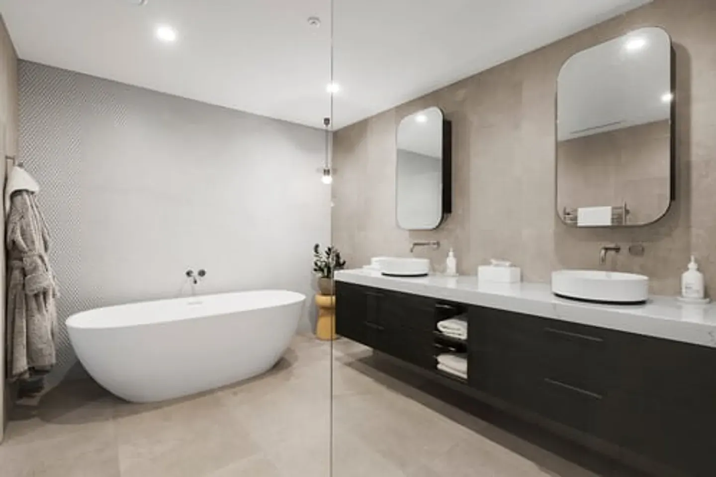 Finished bathroom remodel with double vanity and walk-in shower