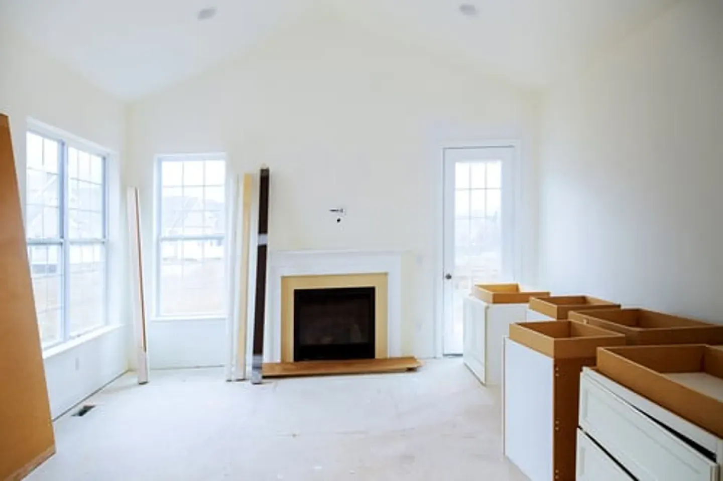 Bright home interior mid-renovation with new cabinetry being installed