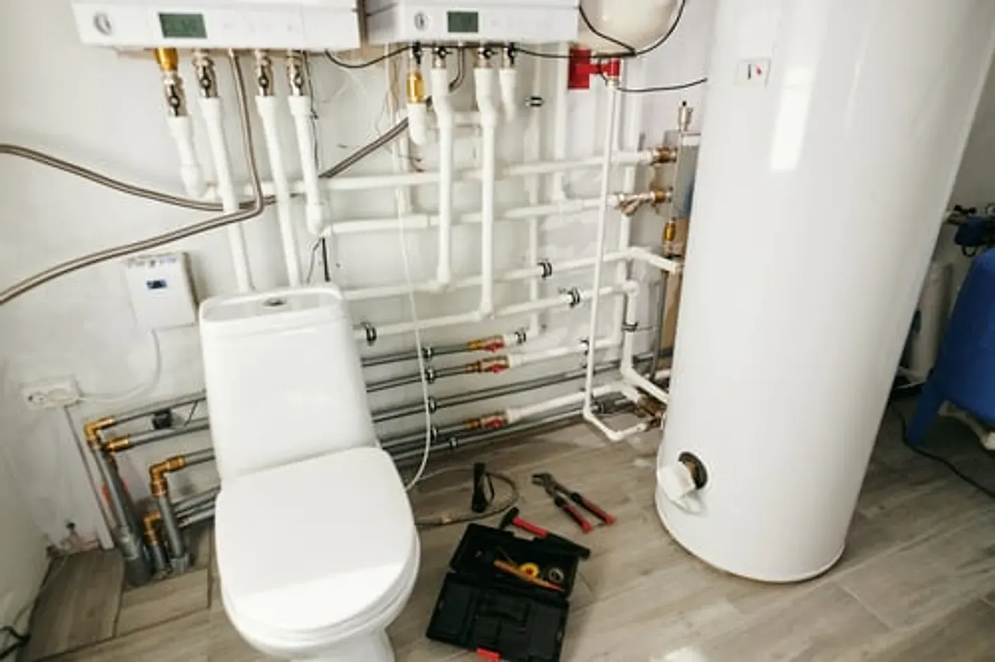 Clean plumbing installation with water heater and copper lines
